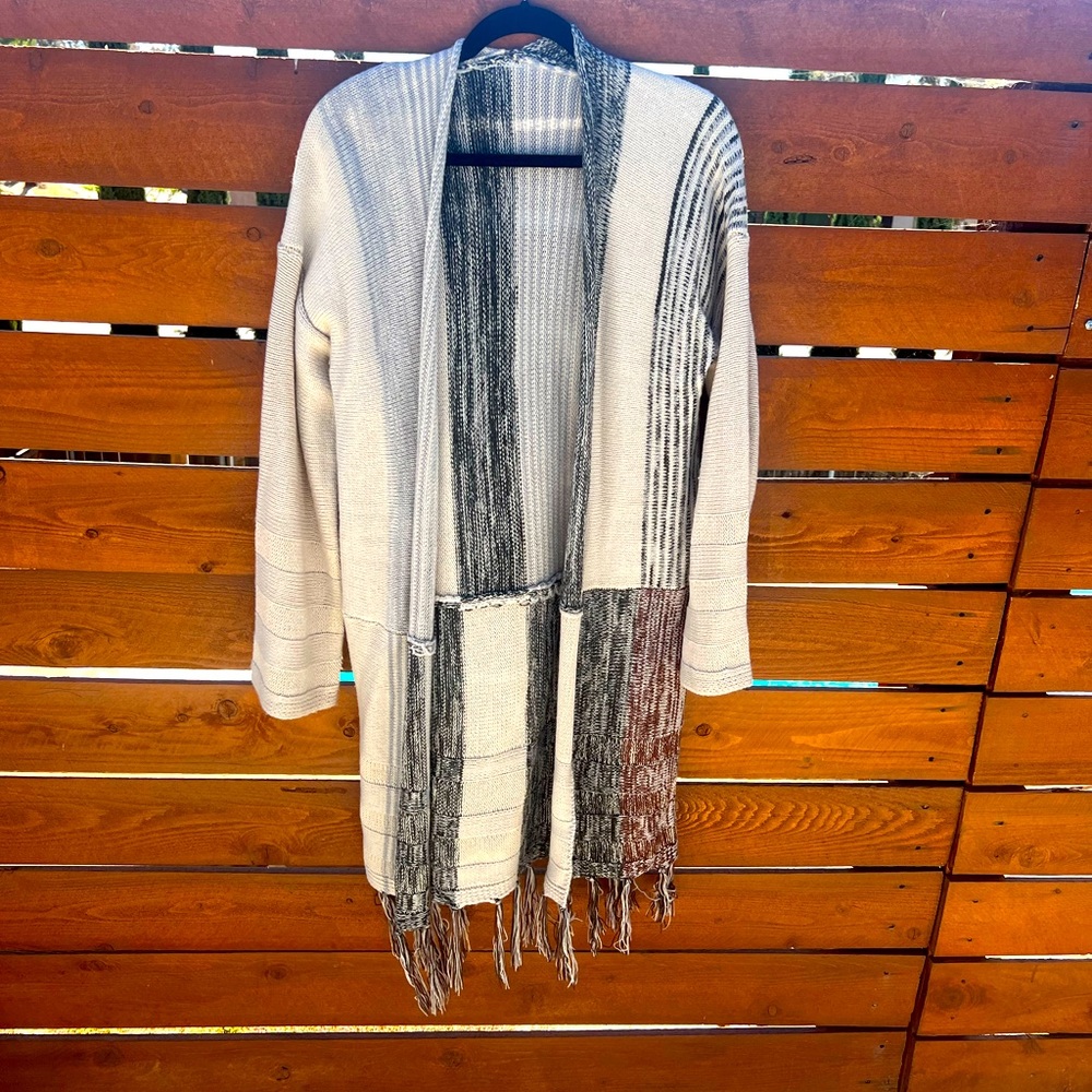 Like new, long sleeve open sweater with fringe. XL.